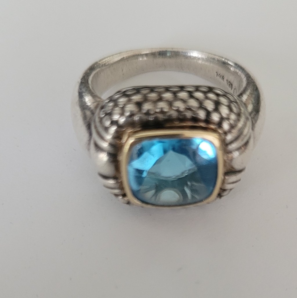 Elegant Silver, Gold And Topaz Gemstone Ring
